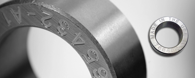 Engraved stailess steel circular part.