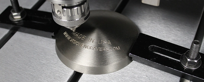 Engrivng a dome shaped metal cap.